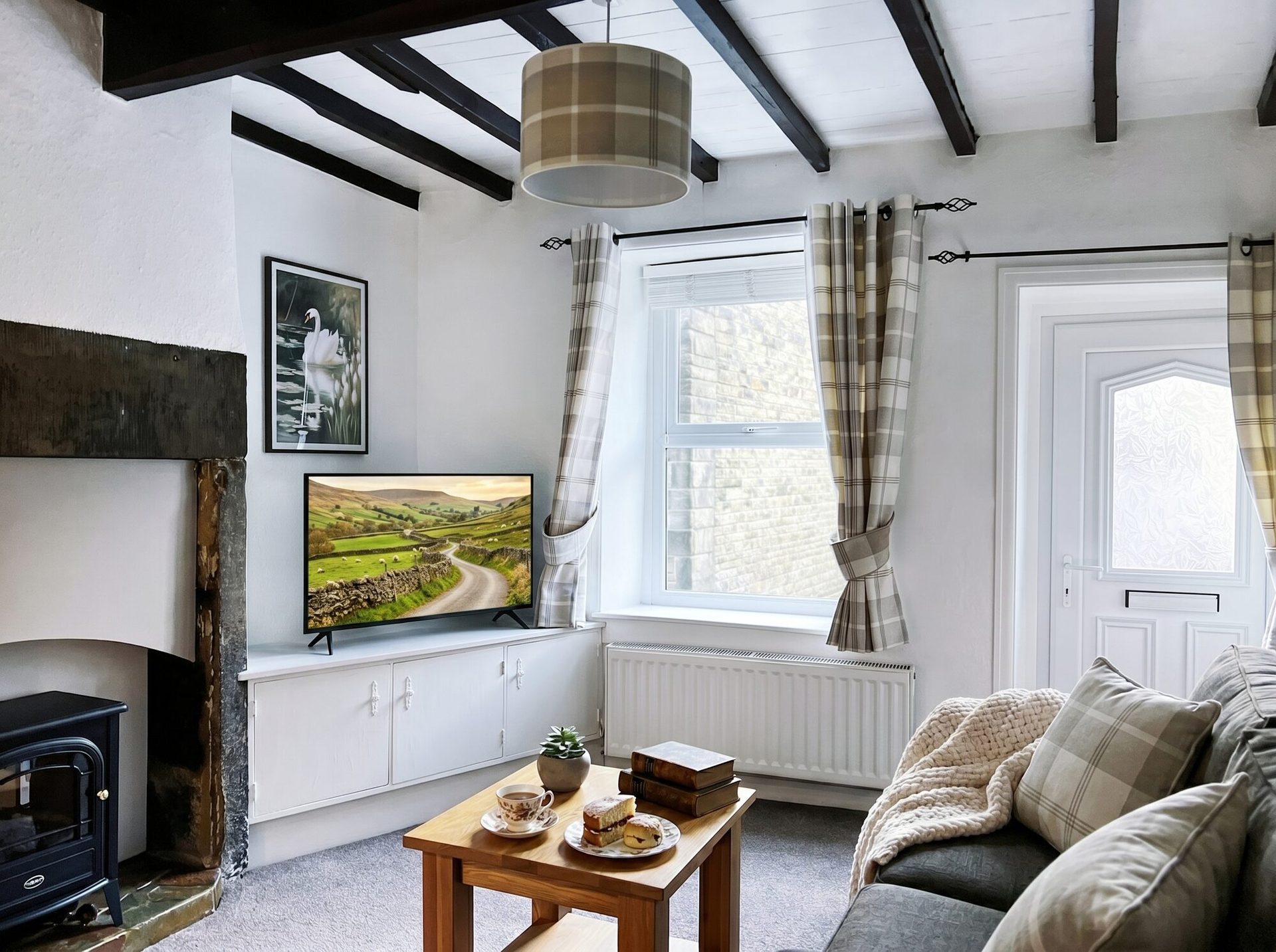 The Willow Nook lounge with beams and log burner